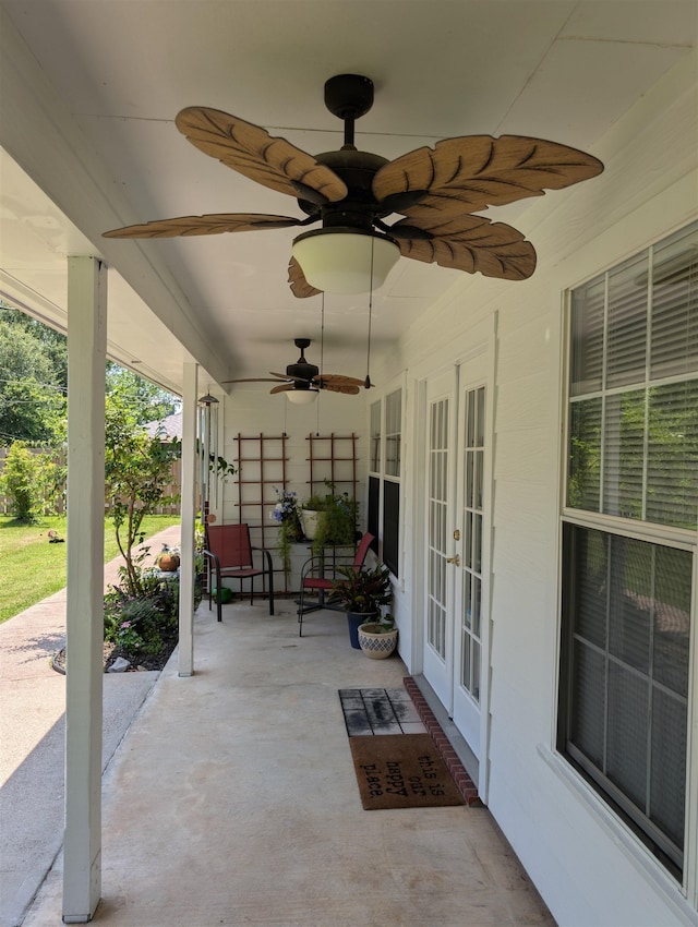 6220 32nd St, Groves, TX 77619 - view of patio / terrace featuring french doors and ceiling fan