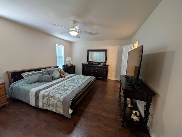 6220 32nd St, Groves, TX 77619 - bedroom featuring dark wood-style flooring and a ceiling fan