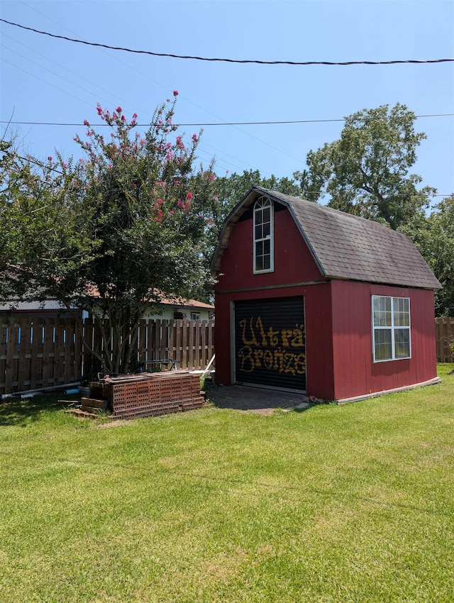 6220 32nd St, Groves, TX 77619 - view of outdoor structure with driveway