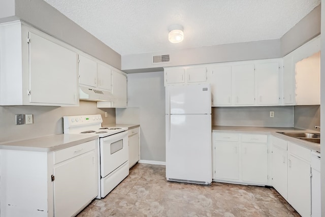 kitchen featuring a textured ceiling, white appliances, white cabinetry, and sink