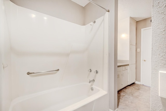 bathroom with vanity and shower / bathing tub combination