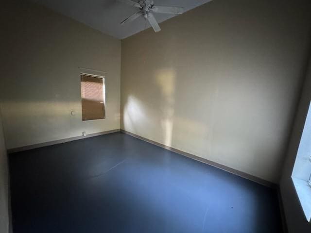 301 W Lavielle, Kirbyville, TX 75956 - spare room with concrete flooring, baseboards, and ceiling fan