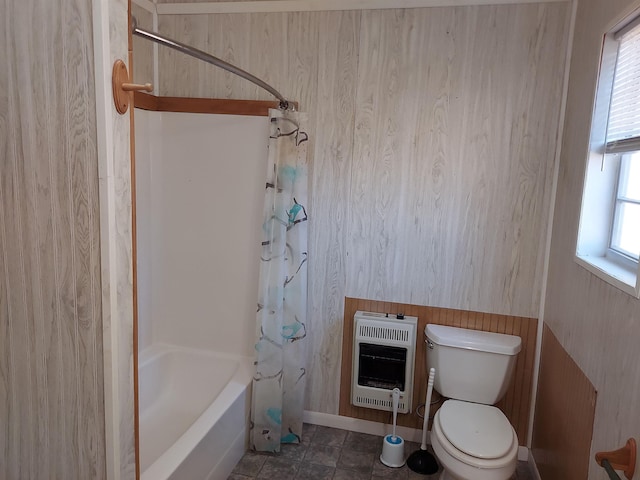 bathroom with shower / bath combination with curtain, toilet, wooden walls, and heating unit