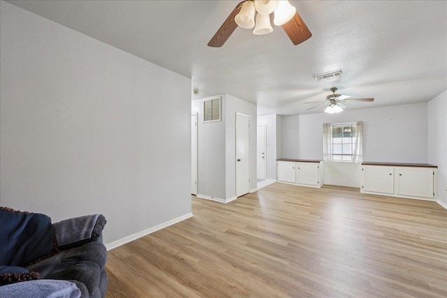 9385 Glen Mdw, Beaumont, TX 77706 - living area with ceiling fan and light wood-type flooring