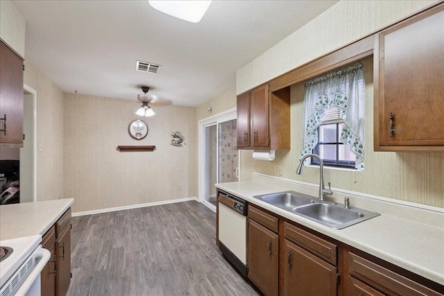 9385 Glen Mdw, Beaumont, TX 77706 - kitchen featuring white dishwasher, light countertops, wood finished floors, and electric stove