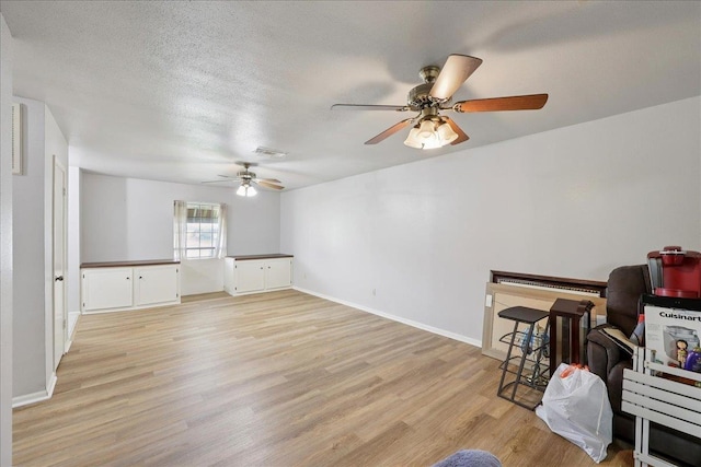 9385 Glen Mdw, Beaumont, TX 77706 - unfurnished living room with ceiling fan and light wood-style flooring