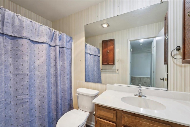 9385 Glen Mdw, Beaumont, TX 77706 - full bath featuring vanity and wallpapered walls
