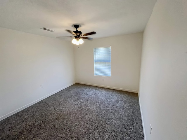 spare room with ceiling fan and carpet floors