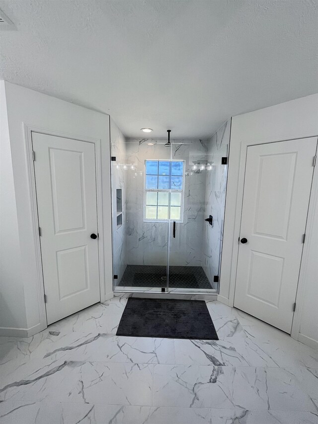 bathroom featuring an enclosed shower