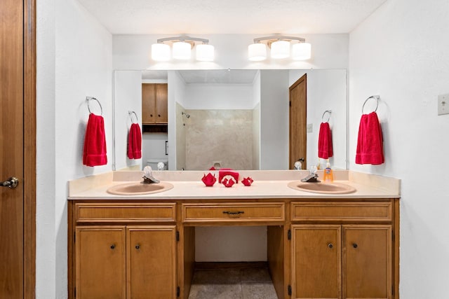 full bathroom featuring walk in shower, a sink, and double vanity