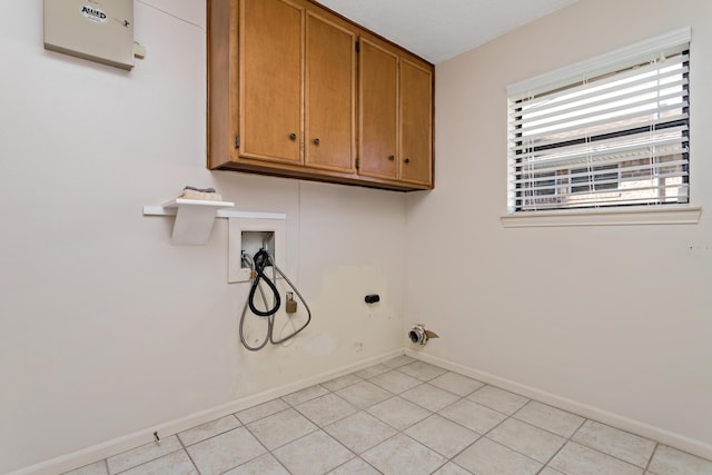 laundry area featuring hookup for an electric dryer, light tile patterned flooring, baseboards, cabinet space, and washer hookup