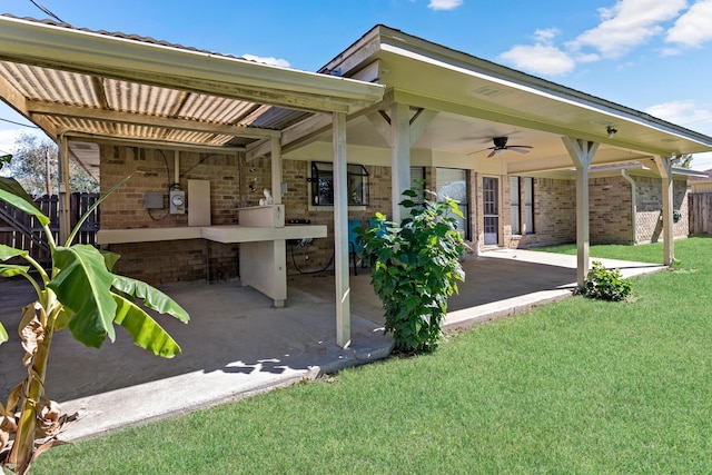 view of patio / terrace featuring a ceiling fan and fence