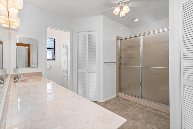 full bathroom with crown molding, a stall shower, ceiling fan with notable chandelier, and a closet