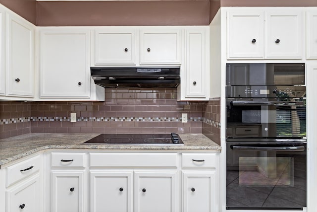 kitchen with ventilation hood, backsplash, white cabinetry, and black appliances