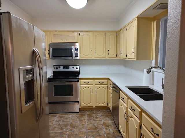 kitchen with sink, crown molding, stainless steel appliances, and backsplash