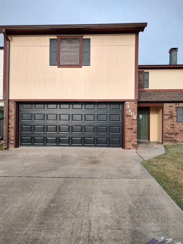 view of front of property with a garage