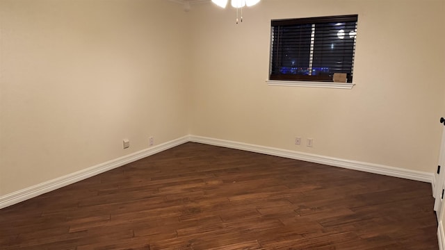 spare room featuring dark hardwood / wood-style floors