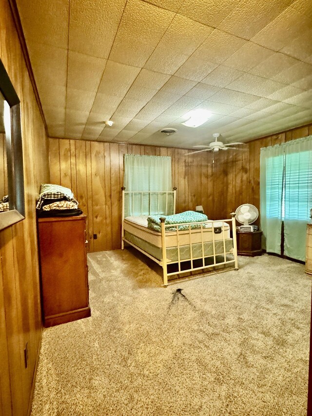 3704 Nightingale St, Orange, TX 77630 - carpeted bedroom with wooden walls