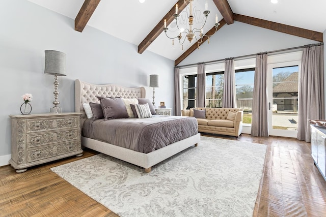 bedroom featuring access to exterior, beam ceiling, high vaulted ceiling, and wood finished floors