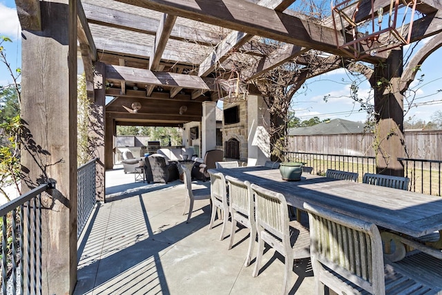 view of patio / terrace with outdoor dining space, an outdoor stone fireplace, fence, and a pergola