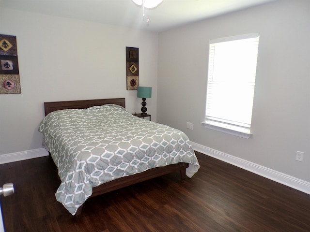 4261 Carlene Dr, Orangefield, TX 77630 - bedroom featuring baseboards and wood finished floors