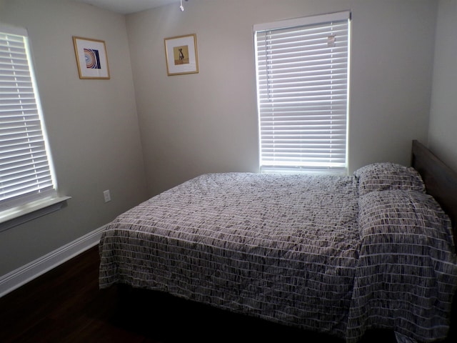 4261 Carlene Dr, Orangefield, TX 77630 - bedroom featuring dark wood-style floors and baseboards