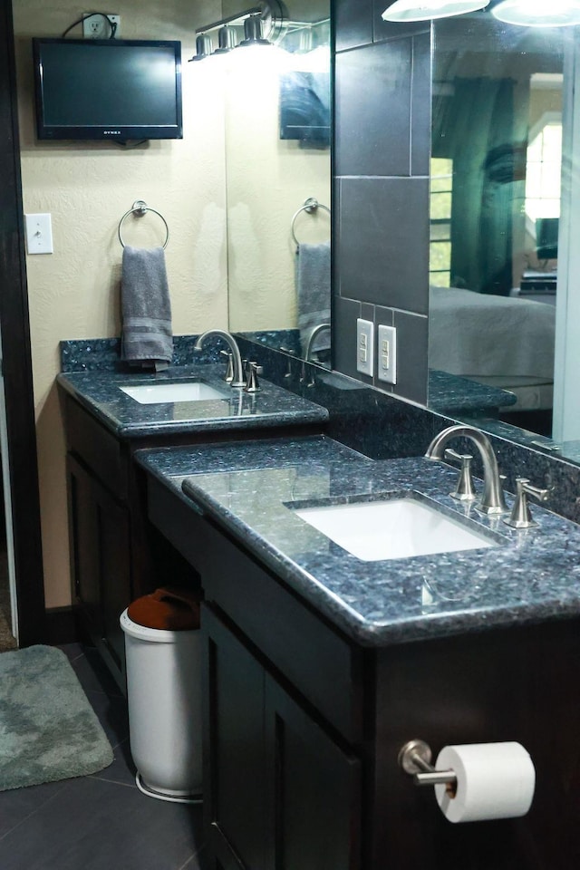 1620 Wellington Pl, Beaumont, TX 77706 - bathroom featuring double vanity and tile patterned flooring