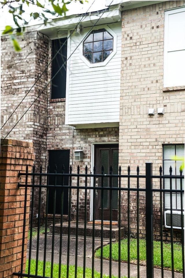 1620 Wellington Pl, Beaumont, TX 77706 - back of house featuring brick siding