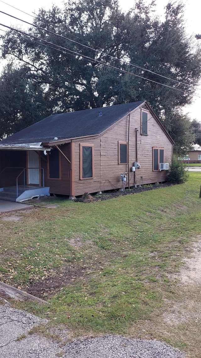 view of property exterior featuring a yard