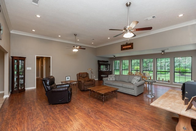 living area with crown molding, ceiling fan, wood finished floors, and visible vents