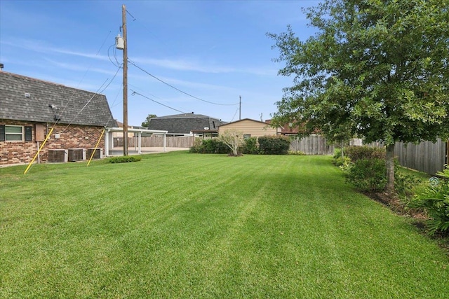 view of yard with central air condition unit