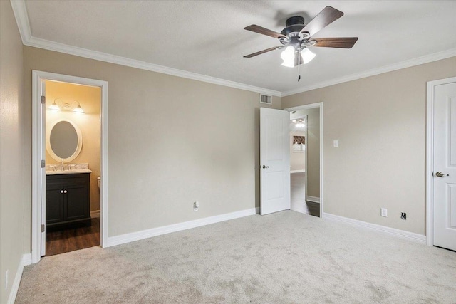 unfurnished bedroom with carpet, sink, ceiling fan, ornamental molding, and connected bathroom