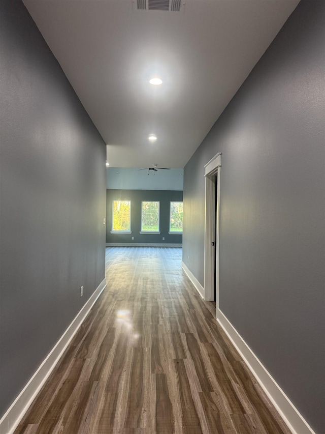 corridor with dark wood-type flooring