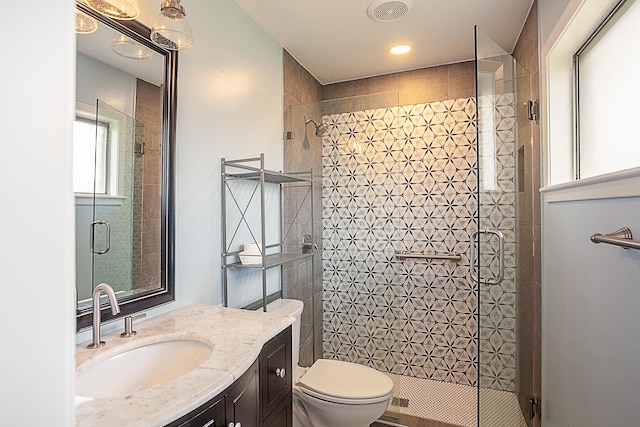 6215 Westgate Dr, Beaumont, TX 77706 - bathroom with a shower stall, vanity, toilet, and recessed lighting