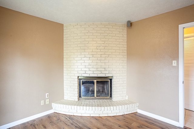 6215 Westgate Dr, Beaumont, TX 77706 - detailed view of wood finished floors, baseboards, and a fireplace