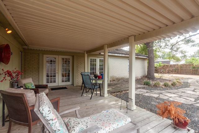 6215 Westgate Dr, Beaumont, TX 77706 - deck with french doors and outdoor dining area