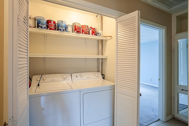 6215 Westgate Dr, Beaumont, TX 77706 - laundry room featuring washing machine and clothes dryer and light carpet