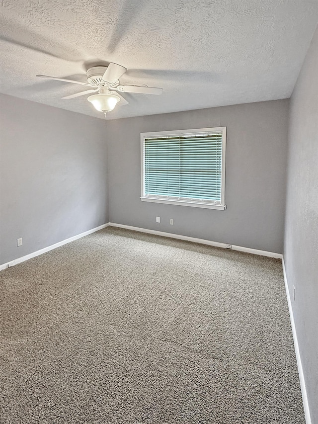 6215 Westgate Dr, Beaumont, TX 77706 - carpeted empty room featuring a textured ceiling, a ceiling fan, and baseboards