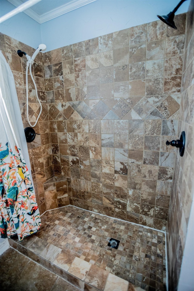 bathroom with curtained shower and ornamental molding