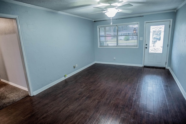 foyer featuring a textured ceiling, ceiling fan, crown molding, and dark wood-type flooring