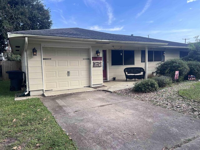 single story home with a garage