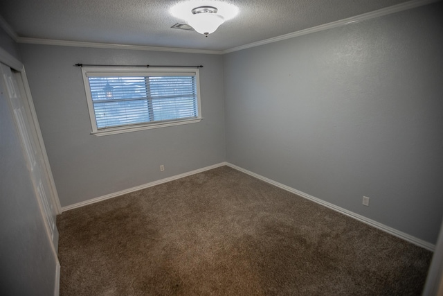 carpeted empty room with crown molding and a textured ceiling