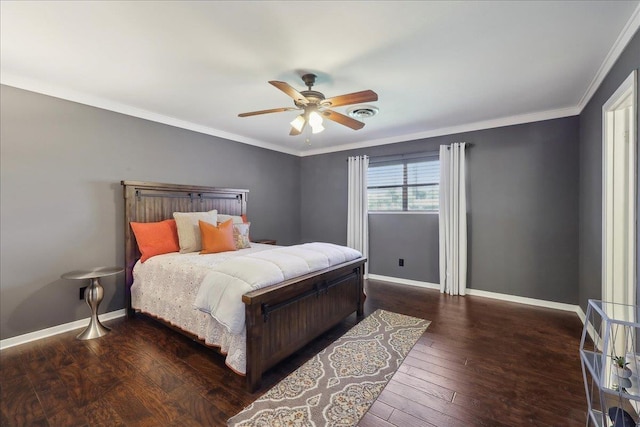 bedroom featuring baseboards, wood finished floors, ornamental molding, and ceiling fan