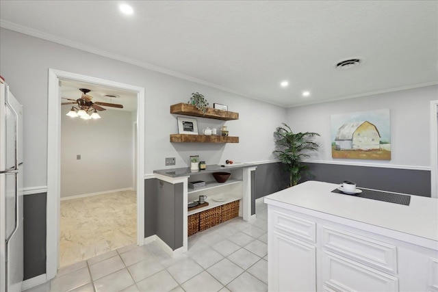 kitchen with open shelves, ceiling fan, white cabinetry, ornamental molding, and an office area