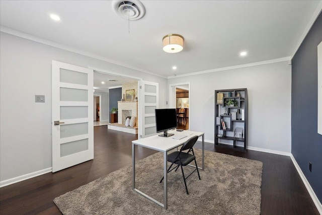 home office with crown molding, a fireplace, dark wood finished floors, baseboards, and recessed lighting