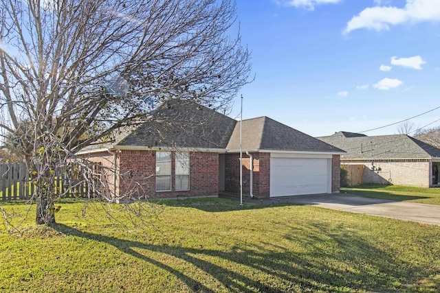 ranch-style home with a garage and a front lawn