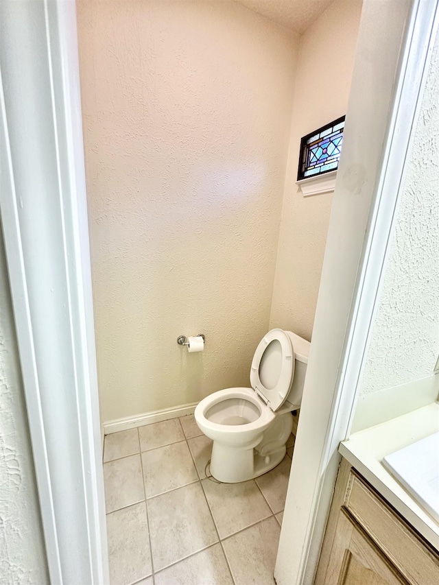 bathroom with tile patterned floors and toilet