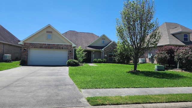 craftsman inspired home with brick siding, central AC, a front lawn, and concrete driveway
