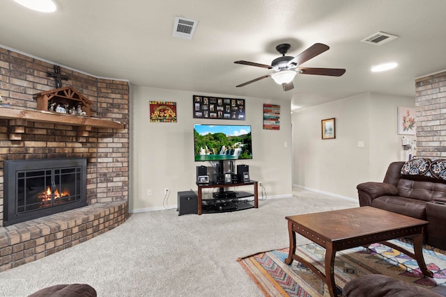 living room featuring baseboards, visible vents, carpet floors, and a brick fireplace