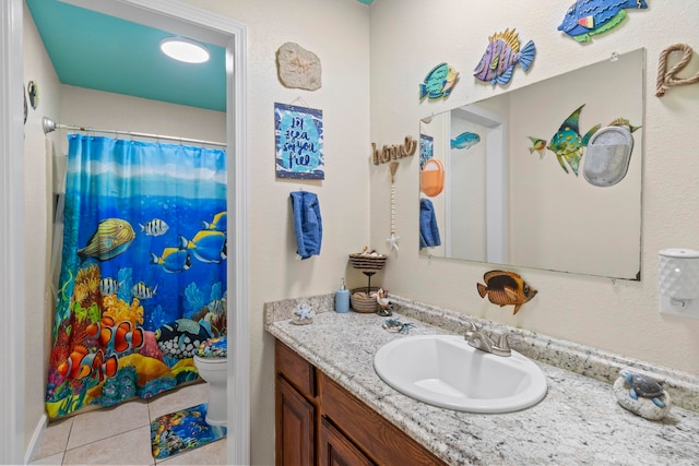 bathroom featuring vanity, tile patterned floors, toilet, and a shower with curtain